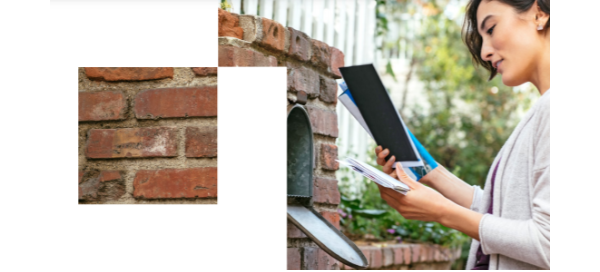 Woman retrieving mail from the mailbox