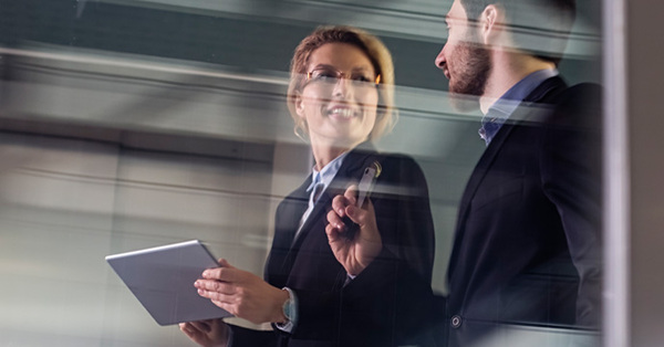 Blurred image of businessman and woman.