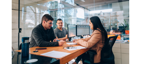 Three people in a meeting